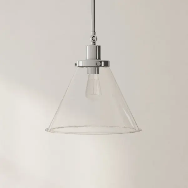 The Hinton pendant combines rustic farmhouse charm with transitional versatility. Its seeded glass shade and brushed nickel finish create a vintage-inspired look that works beautifully over kitchen islands or dining tables.