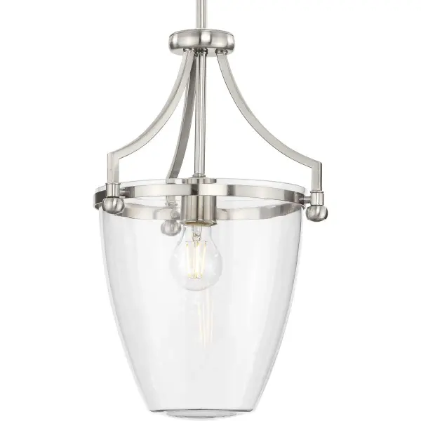 The Parkhurst mini-pendant combines clear glass with brushed nickel for a clean, transitional look that works in multiple settings. Its compact size makes it perfect for kitchen islands, dining areas, or clustered installations.