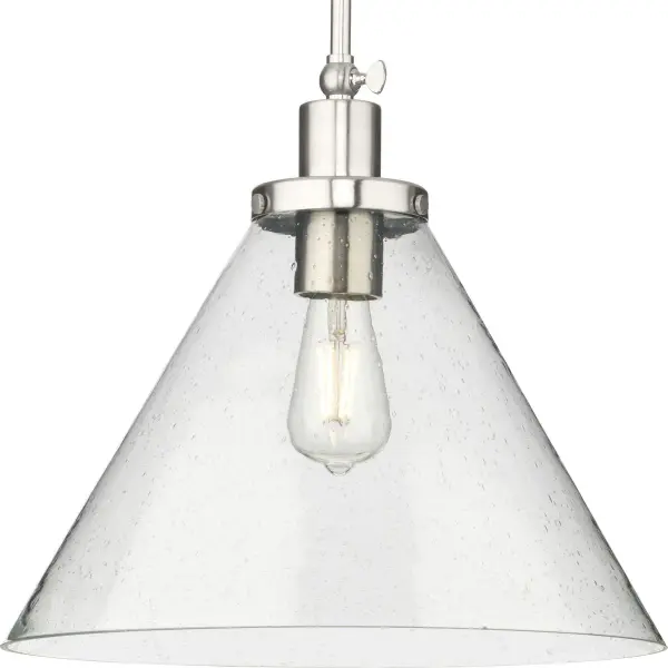The Hinton pendant blends transitional elegance with coastal and farmhouse influences, making it a versatile choice for kitchens, dining areas, and bedrooms. Its brushed nickel finish offers timeless appeal.
