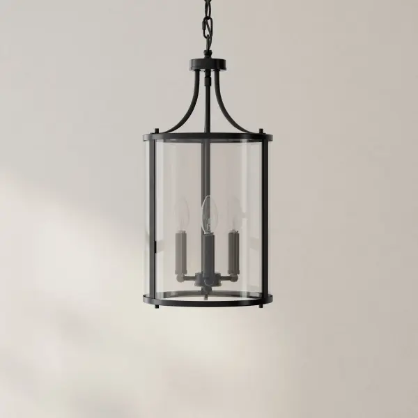 The Gilliam three-light pendant combines transitional elegance with farmhouse charm in a brushed nickel finish. Ideal for foyers, hallways, and dining areas, this fixture provides ample illumination while making a sophisticated design statement.
