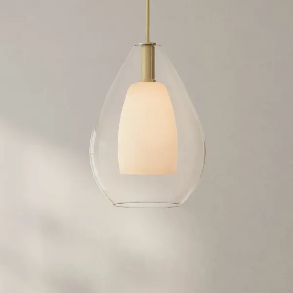 The Carillon Collection pendant offers a sophisticated blend of contemporary and farmhouse aesthetics in a large-scale format. Its brushed nickel finish provides versatility across multiple design schemes while maintaining a refined presence. - alternate view