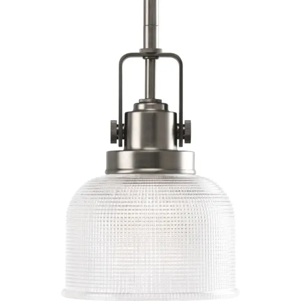 The Archie mini-pendant combines timeless coastal style with functional prismatic glass that beautifully diffuses light. Its compact size and Venetian Bronze finish make it versatile for various residential spaces.