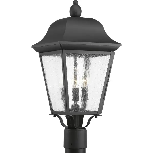 The Kiawah three-light post lantern brings timeless farmhouse style to outdoor spaces with its clean black finish and traditional glass panels. Perfect for illuminating pathways, driveways, and patios with warm, welcoming light.