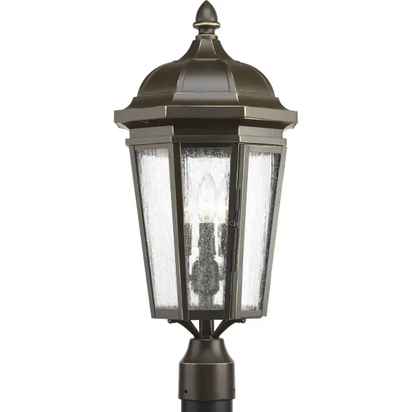 The Verdae post lantern brings traditional elegance to outdoor spaces with its three-light design and antique bronze finish. Perfect for illuminating pathways, driveways, and entryways with warm, welcoming light. - alternate view