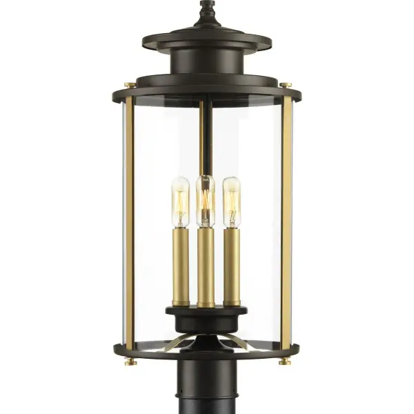 The Squire Collection post lantern brings traditional elegance to outdoor spaces with its three-light design and antique bronze finish. Perfect for illuminating pathways, driveways, and entryways with classic style.