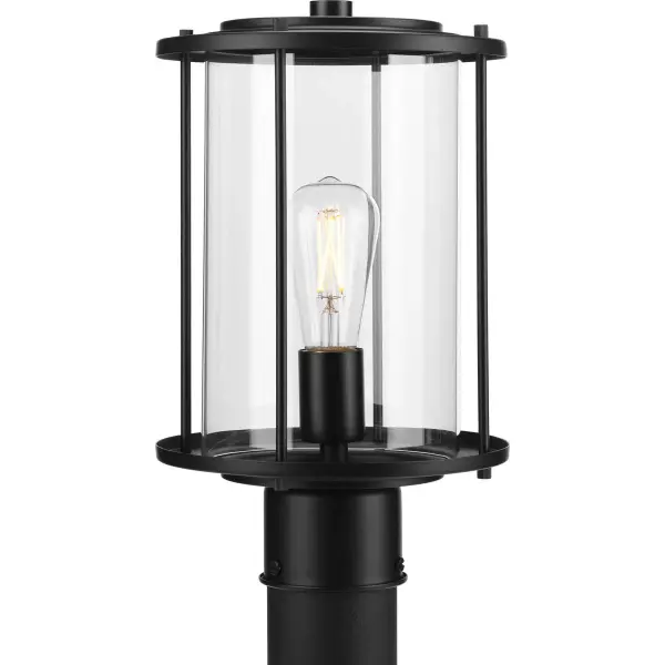 The Gunther Post Lantern combines timeless farmhouse styling with industrial accents in a durable Antique Bronze finish. Perfect for illuminating pathways, driveways, and outdoor living spaces with warm, welcoming light. - alternate view