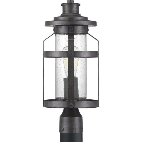 The Haslett post lantern brings rustic farmhouse charm to outdoor spaces with its antique pewter finish and clear glass panels. JA8 compliant for California energy standards, this fixture combines traditional styling with modern efficiency. - alternate view