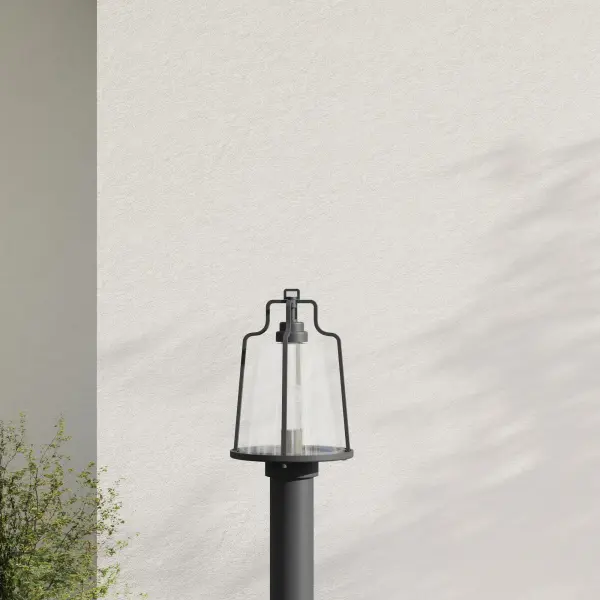 The Benton Harbor post lantern combines urban industrial style with coastal durability through DURASHIELD technology. Its black finish and clean lines make it versatile for modern outdoor spaces.