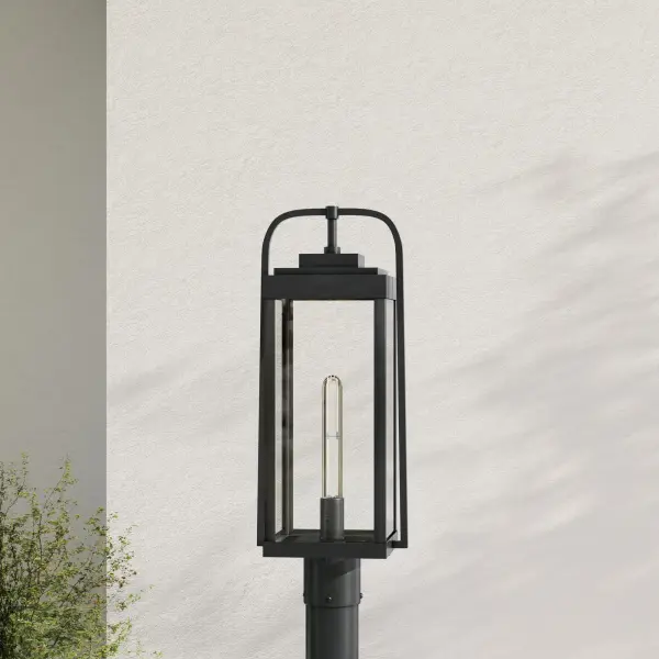 The Walcott post light combines modern farmhouse style with durable outdoor construction. Its clean black finish and clear glass shade provide welcoming illumination for pathways, driveways, and front entries.