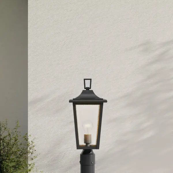 The Padgett post light combines traditional styling with durable outdoor construction. Clear seeded glass creates ambient lighting while the antique bronze finish adds warmth to exterior spaces. - alternate view