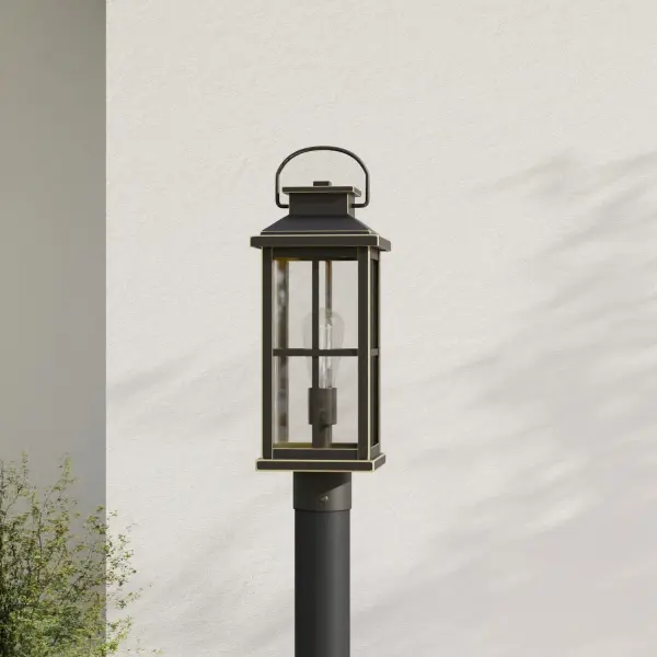 The Williamston post lantern combines timeless farmhouse style with modern outdoor lighting performance. Clear glass panels showcase the light source while antique bronze finish adds warmth and character to any exterior setting.