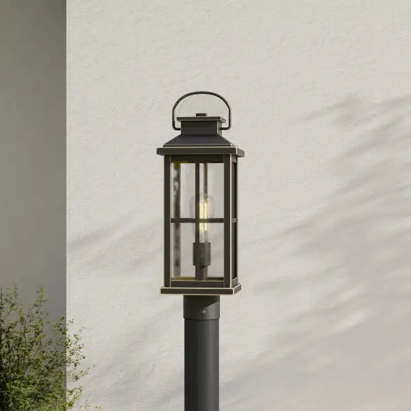 The Williamston post lantern combines timeless farmhouse style with modern outdoor lighting performance. Clear glass panels showcase the light source while antique bronze finish adds warmth and character to any exterior setting. - alternate view