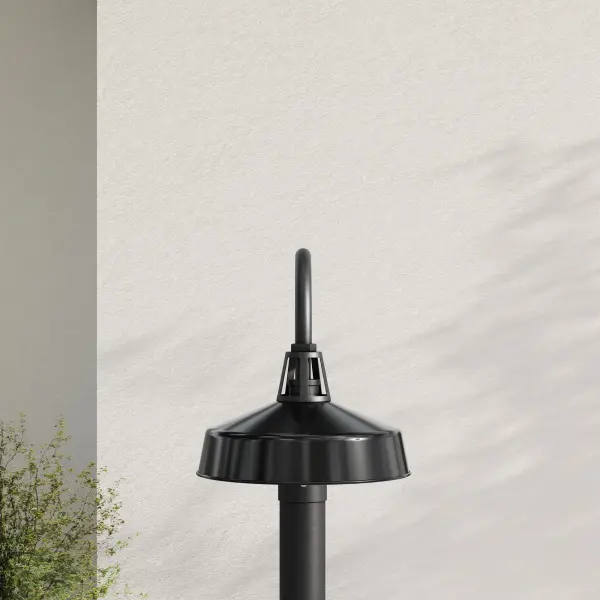 The Cedar Springs post lantern combines farmhouse charm with coastal and industrial influences, featuring a durable black finish and clear glass panels. California Title 24 and JA8 compliant for energy efficiency.