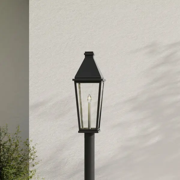 The Richmond Hill post light combines clean modern lines with farmhouse charm, featuring clear glass panels that showcase the bulb while providing ample illumination. Its durable black finish and weather-resistant construction make it ideal for residential and commercial outdoor applications. - alternate view