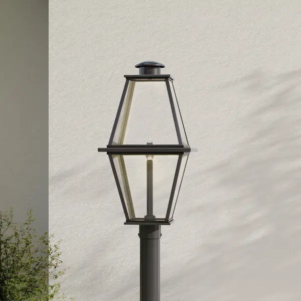 The Bradshaw post lantern combines traditional farmhouse charm with modern outdoor durability. Its clear glass panels and black finish create timeless curb appeal while meeting California Title 24 and JA8 compliance standards. - alternate view