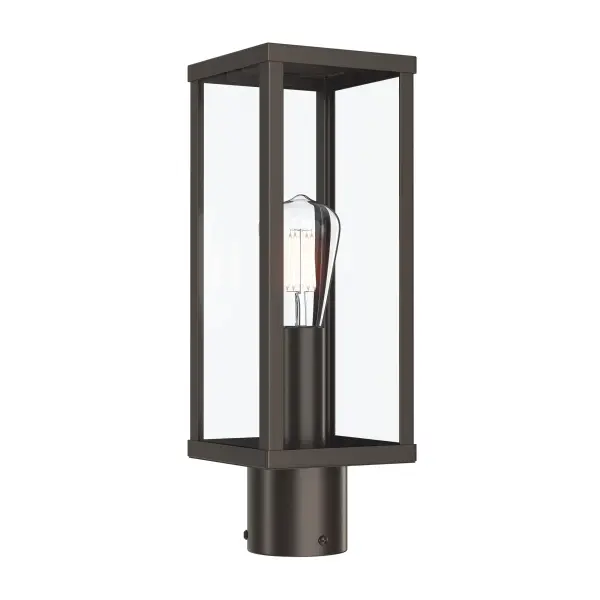 The Ryle Outdoor Wall Light combines traditional design elements with durable outdoor construction. Its antique bronze finish adds warmth and character to exterior spaces while providing reliable illumination.