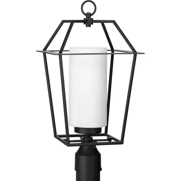 The Chilton post light combines farmhouse charm with modern simplicity, featuring etched opal glass that provides warm, diffused illumination. Its black finish and clean lines make it versatile for various outdoor settings.