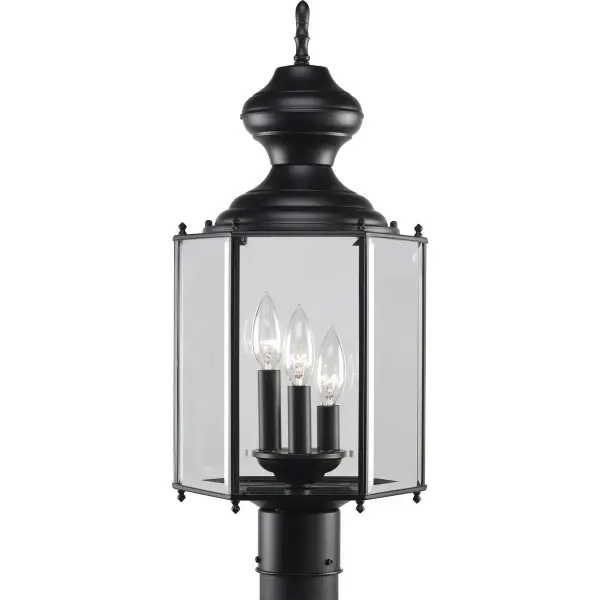 This three-light post lantern brings traditional carriage house charm to outdoor spaces with its matte black finish and clear glass panels. JA8 compliant for California energy standards, it combines classic styling with modern efficiency.