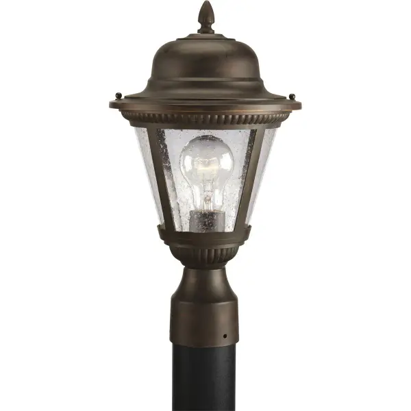 The Westport Post Lantern brings traditional elegance to outdoor spaces with its antique bronze finish and clear glass panels. Perfect for illuminating pathways, driveways, and entryways with classic charm. - alternate view