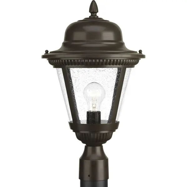 The Westport post lantern brings traditional elegance to outdoor spaces with its antique bronze finish and clear glass panels. JA8 compliant for California energy standards, this medium-sized fixture provides reliable illumination for pathways, patios, and entryways.