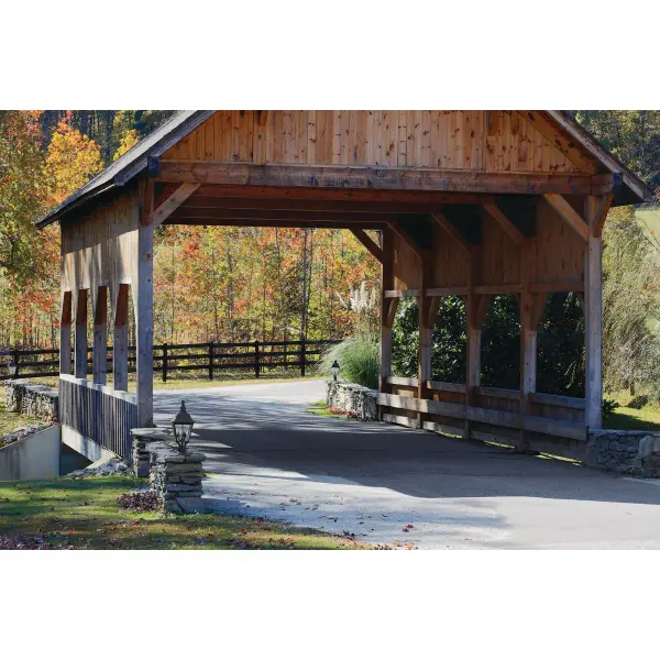 The Andover post lantern brings traditional elegance to outdoor spaces with its three-light design and antique bronze finish. Perfect for coastal, farmhouse, and transitional homes seeking classic curb appeal. - alternate view