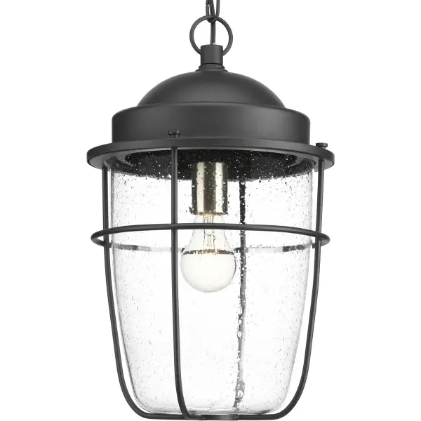 The Holcombe hanging lantern blends timeless farmhouse charm with coastal and industrial influences. Its black finish and clear glass panels create a versatile outdoor fixture perfect for porches and patios.