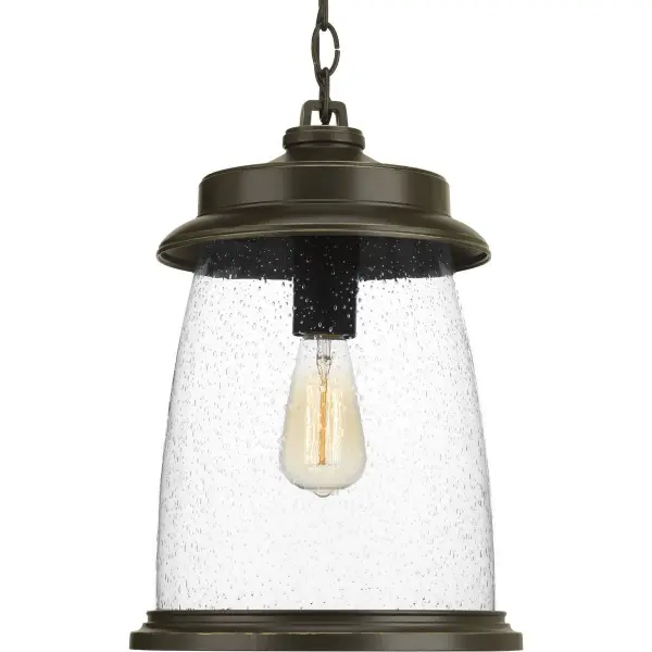 The Conover Hanging Lantern combines traditional lantern styling with transitional elegance, featuring an Antique Bronze finish that weathers beautifully outdoors. Perfect for porches and patios seeking coastal or farmhouse charm.