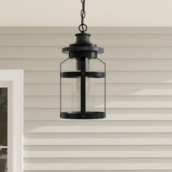 The Haslett hanging lantern brings timeless farmhouse style to porches and patios with its antique pewter finish and clear glass panels. JA8 compliant for California energy standards, this fixture combines rustic appeal with modern efficiency.