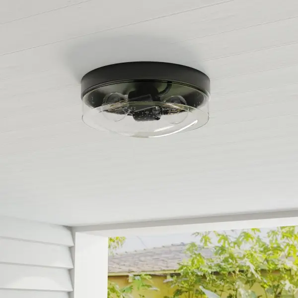 The Weldon flush mount combines farmhouse charm with transitional versatility, making it ideal for porches, patios, and interior spaces. Its compact two-light design and JA8 compliance ensure energy efficiency.