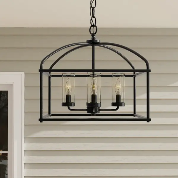 The Swansea outdoor chandelier combines rustic farmhouse style with weather-resistant construction. Its 18-inch profile makes it ideal for covered porches and smaller outdoor spaces while providing four-light illumination. - alternate view