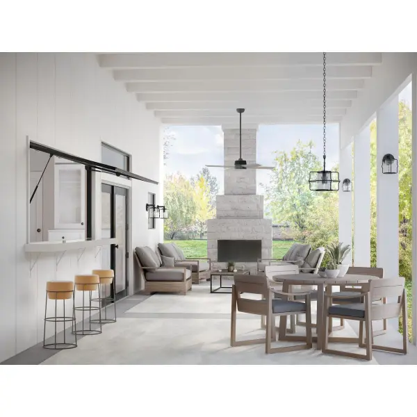 The Keegan outdoor hanging lantern combines industrial style with coastal elegance. Its matte black finish and clear glass panels create a striking silhouette while providing excellent illumination for covered outdoor spaces. - alternate view