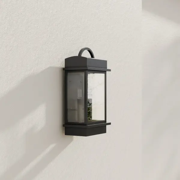 The Santee wall lantern combines timeless farmhouse design with modern outdoor performance. Its antique bronze finish and clear glass panels create welcoming illumination for entryways and patios while meeting JA8 energy standards.