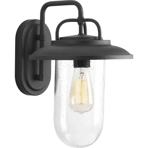 The Beaufort wall lantern combines rustic farmhouse aesthetics with industrial undertones, featuring a clean black finish and clear glass panels. Perfect for porches and patios, this medium-sized fixture delivers timeless style with JA8-compliant efficiency.