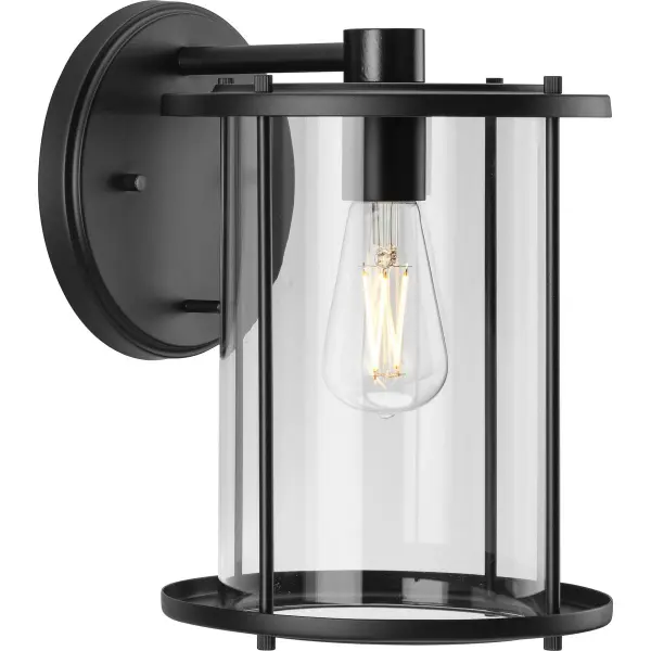 The Gunther Large Wall Lantern combines rustic farmhouse aesthetics with industrial durability. Its antique bronze finish and clear glass panels create welcoming illumination for outdoor spaces while meeting JA8 energy standards.