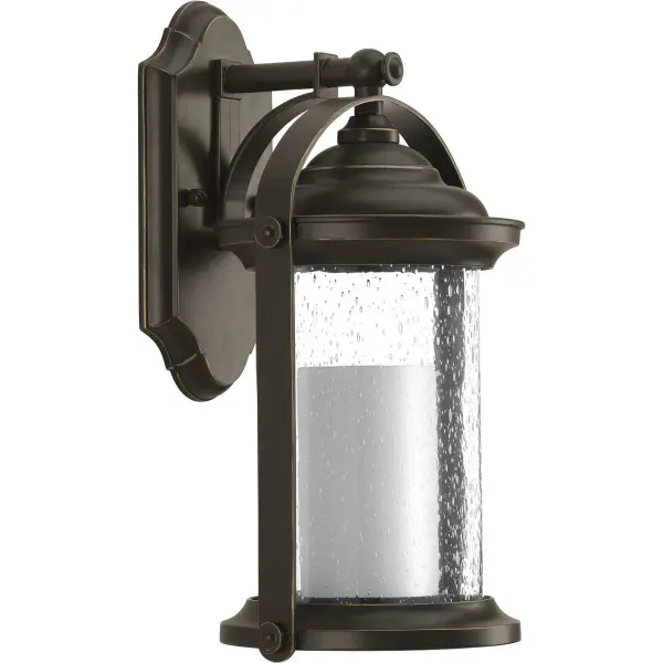 The Whitacre Small Wall Lantern brings timeless transitional style to your home's exterior with its antique bronze finish and traditional lantern silhouette. Perfect for porches, patios, and entryways.