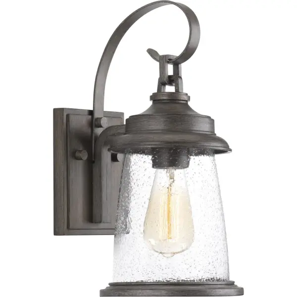 The Conover Small Wall Lantern blends traditional lantern styling with transitional elegance, featuring an antique bronze finish and clear glass panels. Perfect for outdoor entryways and porches seeking timeless curb appeal.