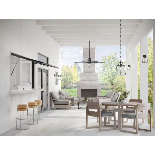 The Benton Harbor wall lantern combines industrial style with coastal durability through DURASHIELD technology. Its compact size and black finish make it ideal for residential porches and patios while meeting JA8 compliance. - alternate view