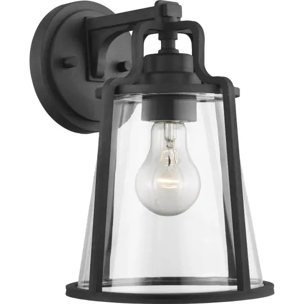 The Benton Harbor wall lantern combines industrial style with coastal durability through DURASHIELD technology. Its black finish and clear glass design provides reliable outdoor lighting with modern appeal.