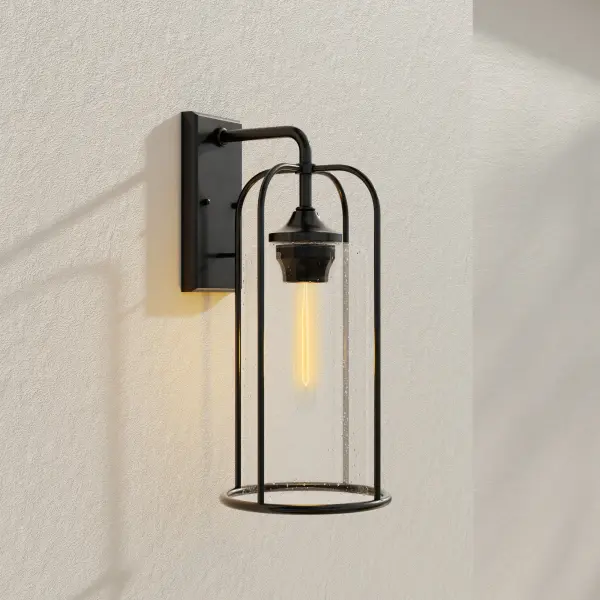 The Watch Hill wall lantern combines timeless farmhouse styling with clear seeded glass and a durable black finish. Perfect for creating welcoming outdoor spaces with its large-scale presence and warm ambient lighting. - alternate view