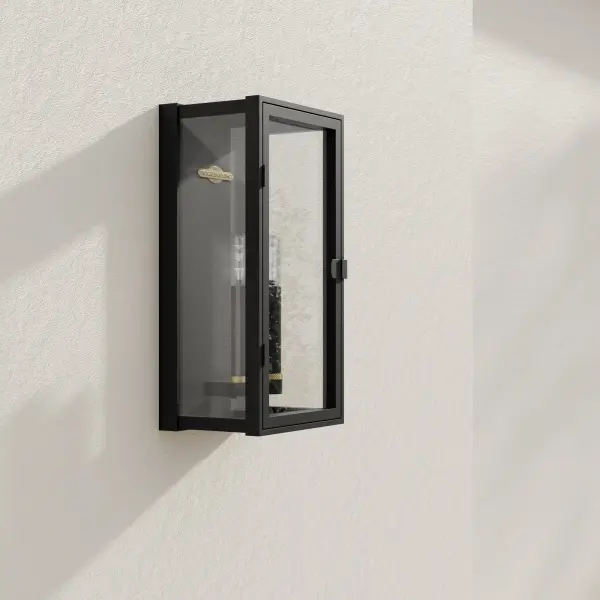 The Stature Collection wall lantern combines clean modern lines with traditional lantern styling. Two-light design with clear glass panels provides excellent illumination for outdoor spaces while maintaining architectural appeal.