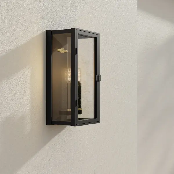 The Stature Collection wall lantern combines clean modern lines with traditional lantern styling. Two-light design with clear glass panels provides excellent illumination for outdoor spaces while maintaining architectural appeal. - alternate view