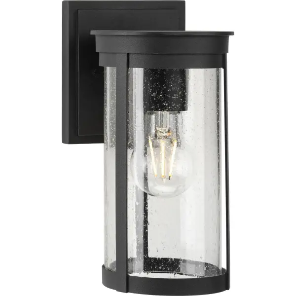 The Belden wall lantern blends modern craftsman styling with transitional appeal, featuring a clean black finish and clear glass shade. Perfect for residential porches and patios, this medium-sized fixture offers JA8 and Title 22 compliance for California installations.