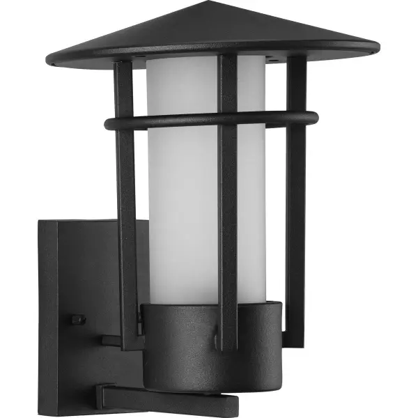 The Exton wall lantern combines contemporary design with textured seeded glass for visual interest. Its black finish and clean lines suit modern exteriors while providing reliable outdoor illumination.