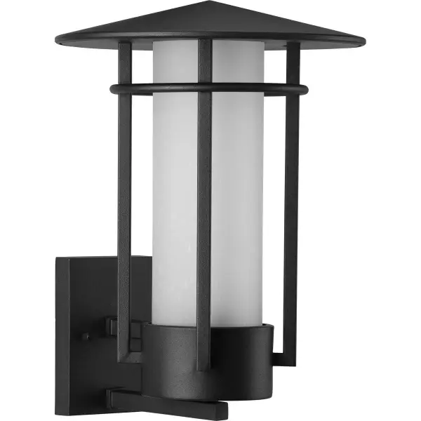 The Exton wall lantern combines modern black metalwork with etched seeded glass for a striking outdoor presence. Its large scale makes a statement while the textured glass creates beautiful light diffusion.