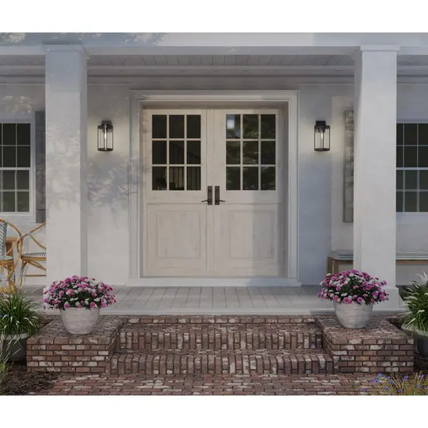 The Whitmire wall lantern combines rustic farmhouse styling with practical outdoor performance. Its matte black finish and clear seeded glass create timeless curb appeal while JA8 compliance ensures energy efficiency. - alternate view