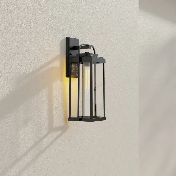 The Walcott Large Wall Lantern combines timeless farmhouse aesthetics with contemporary functionality. Its antique bronze finish and generous size make it ideal for creating a welcoming entrance or illuminating outdoor living spaces. - alternate view
