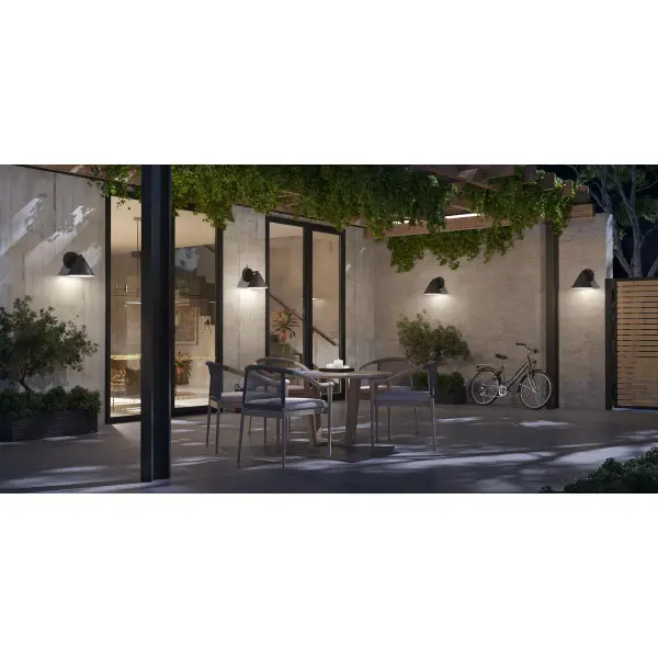 The Ward Collection brings clean-lined sophistication to outdoor spaces with its transitional design and durable black finish. Title 24 and JA8 compliant for California installations, this compact wall lantern delivers reliable illumination. - alternate view