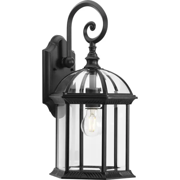 The Dillard wall lantern brings traditional charm to outdoor spaces with its clear glass panels and antique bronze finish. Perfect for residential porches and patios, this fixture combines classic styling with modern compliance.