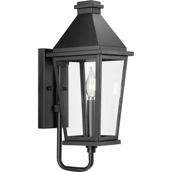The Richmond Hill wall lantern combines timeless farmhouse charm with contemporary clean lines. Its clear glass panels and black finish create a versatile look that complements both traditional and modern exteriors.