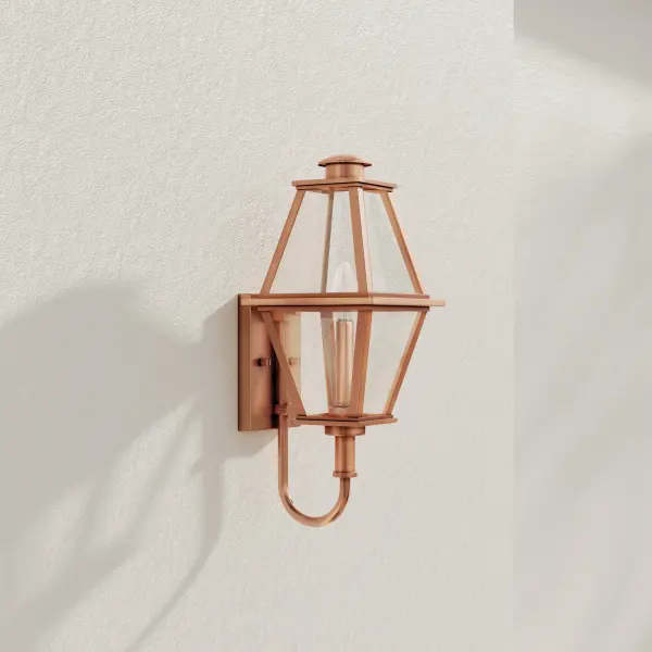 The Bradshaw wall lantern combines traditional charm with transitional versatility. Its clear glass panels and black finish create timeless curb appeal for residential and commercial outdoor spaces.